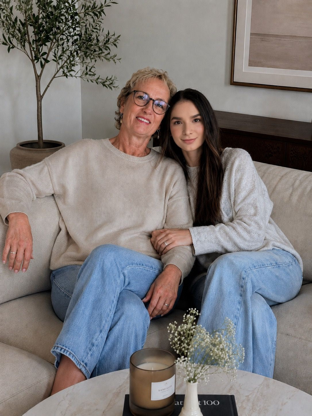 Mother and Daughter Posing on Sofa